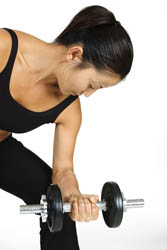 The ending position of a dumbbell concentration curl exercise